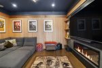 Curl up by the Fireplace for Family Movie Night in the Media Room